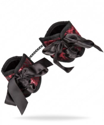 Vackra handklovar med en korsett detalj på utsidan. Bekväm och justerbar passform. Avtagbar kedja. Detaljerat material.