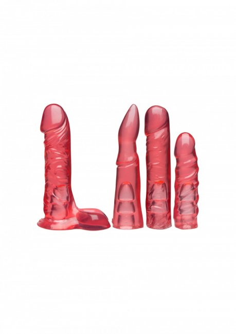 Set med fyra strap-on dildos, en justerbar och vadderad sele, två olika pluggar som funkar med selen eller som en sugkopp.